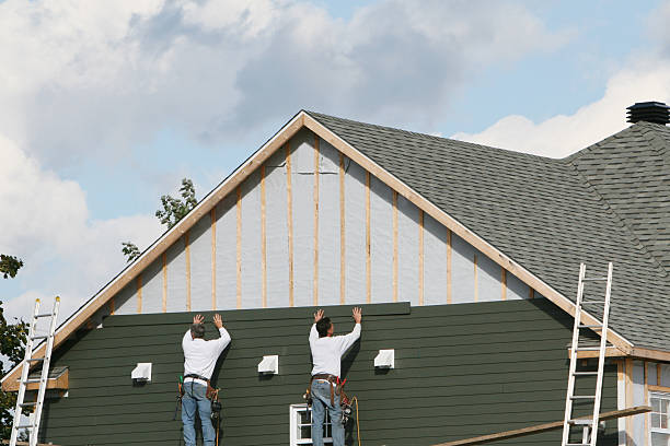 Professional Siding technician working in Freehold, NJ